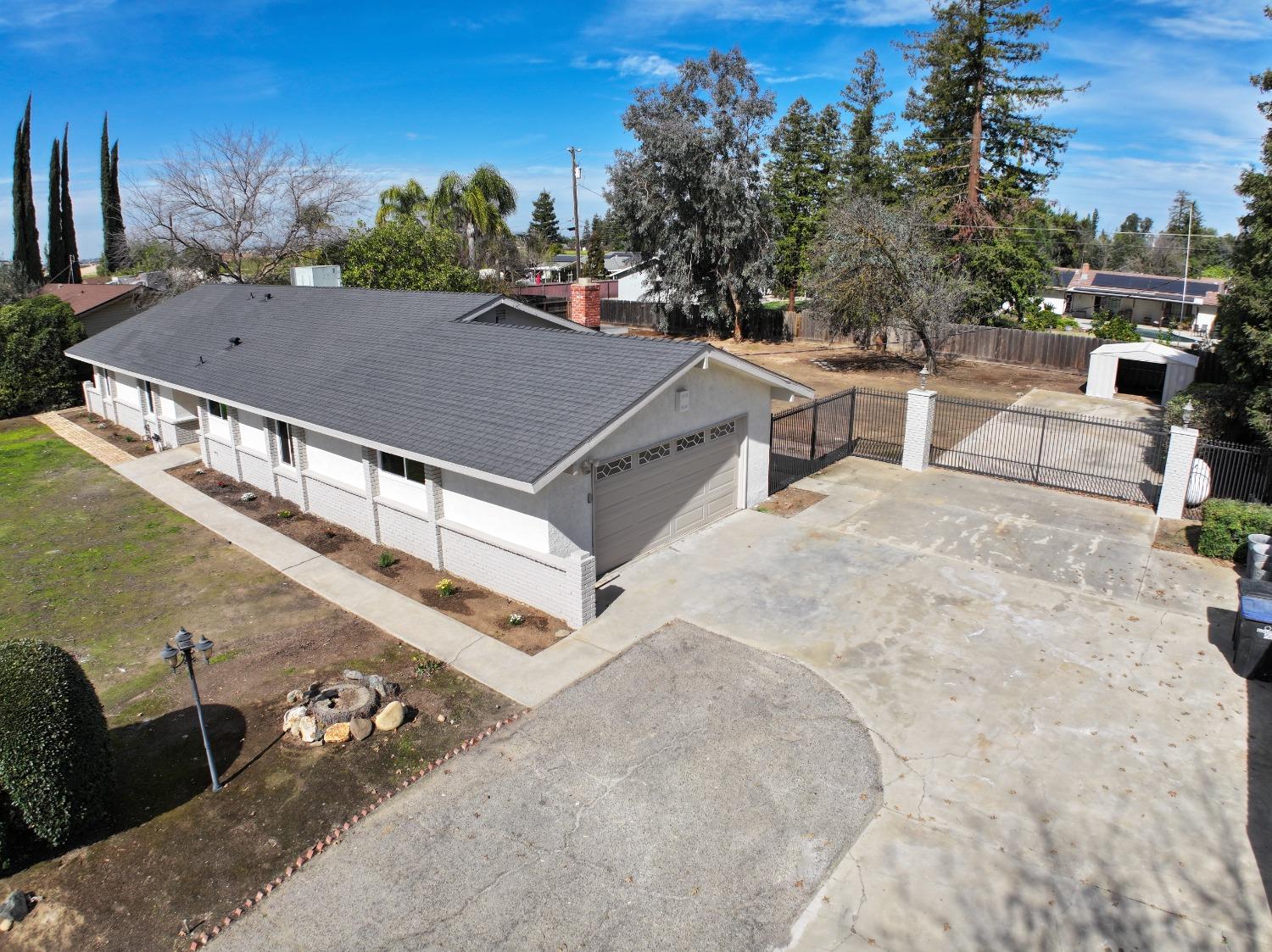 41175 Grove Circle Madera, CA 93636 - Photo 4 of 39 an aerial view of a house with a yard