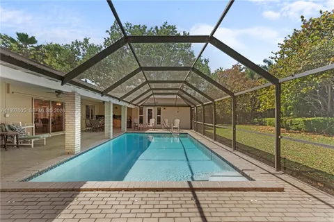 a view of a house with a swimming pool