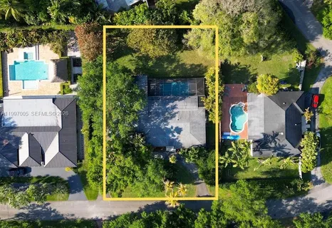 an aerial view of houses and roads