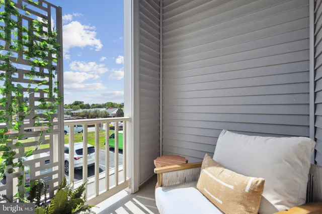 a view of a balcony with furniture