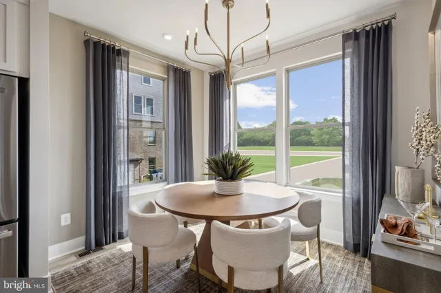 a view of a dining room with furniture window and outside view