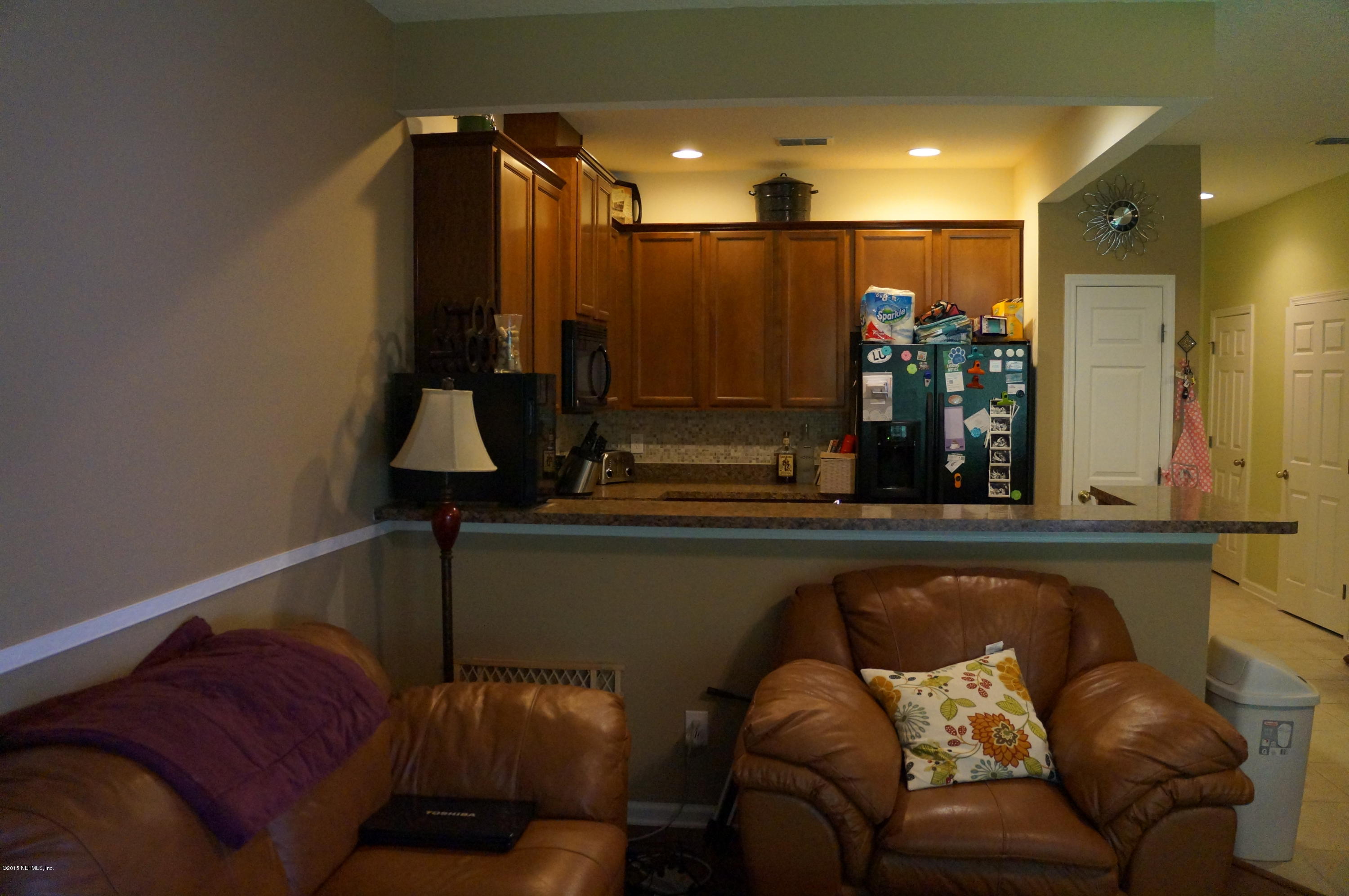 12927 Spring Rain Road Jacksonville, FL 32258 - Photo 8 of 26 a living room with furniture and a mirror