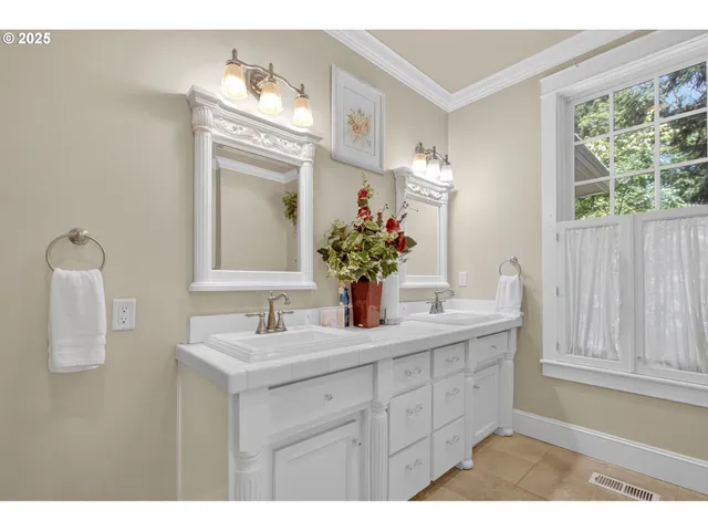 a bathroom with a sink a vanity and a mirror