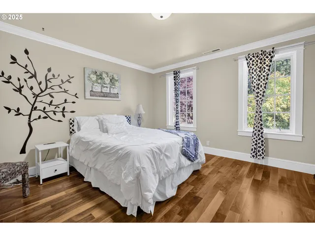 a spacious bedroom with a bed and a window