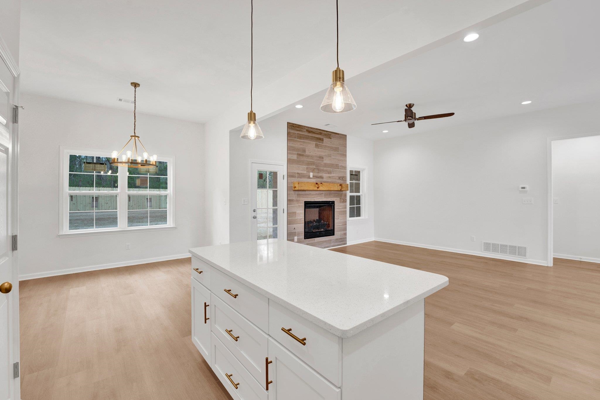 4056 Fonta Road Bartlett, TN 38002 - Photo 16 of 39 Kitchen featuring ceiling fan with notable chandelier, visible vents, light wood-style flooring, and recessed lighting