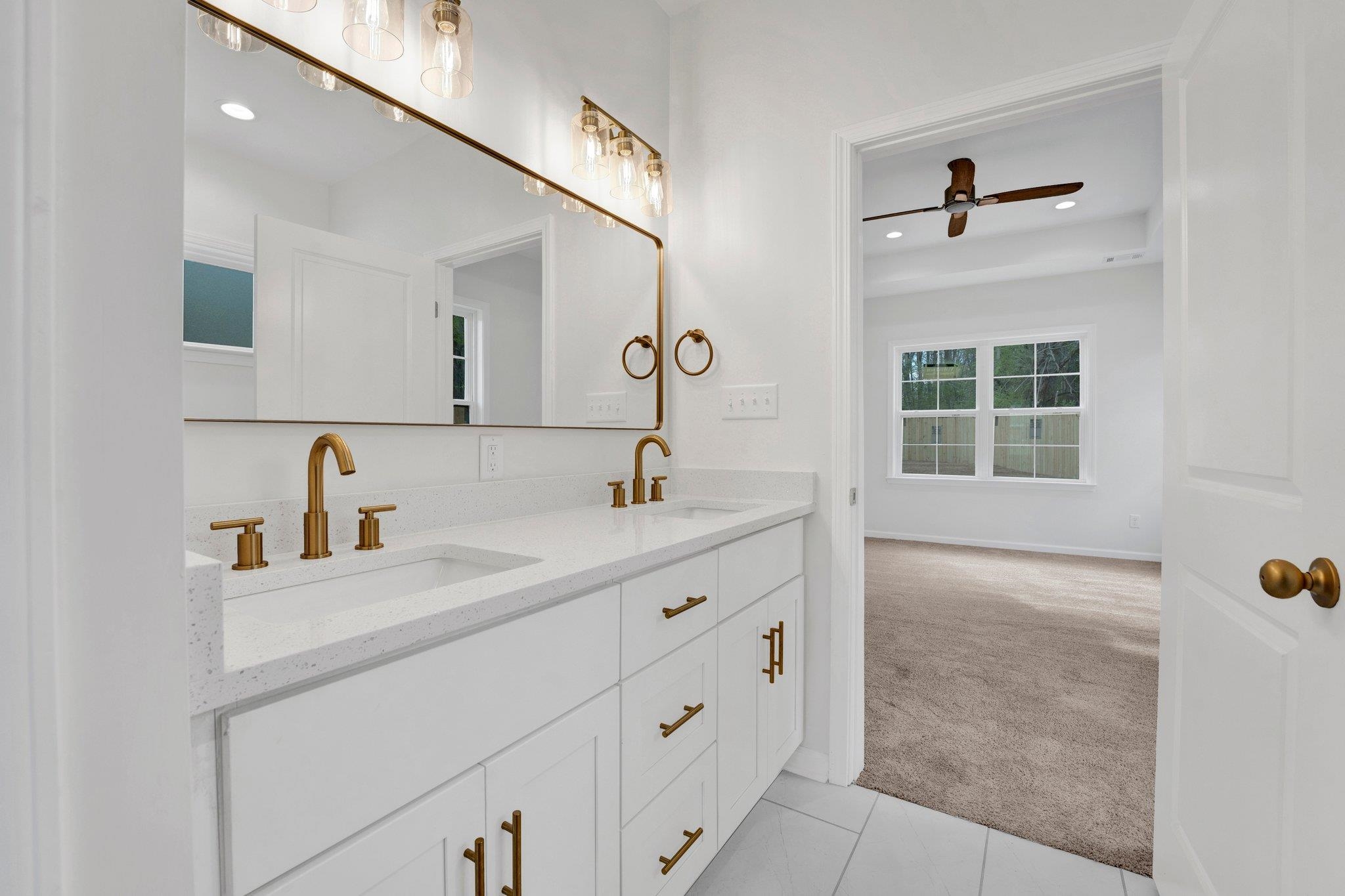 4056 Fonta Road Bartlett, TN 38002 - Photo 25 of 39 Bathroom featuring double vanity, recessed lighting, ceiling fan, and a sink
