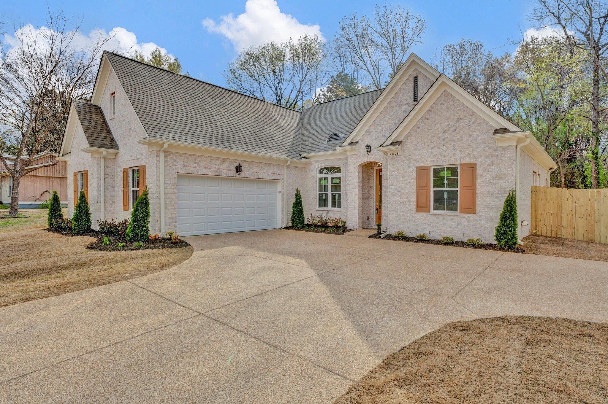 4056 Fonta Road Bartlett, TN 38002 - Photo 4 of 39 French country home with roof with shingles, driveway, fence, and an attached garage