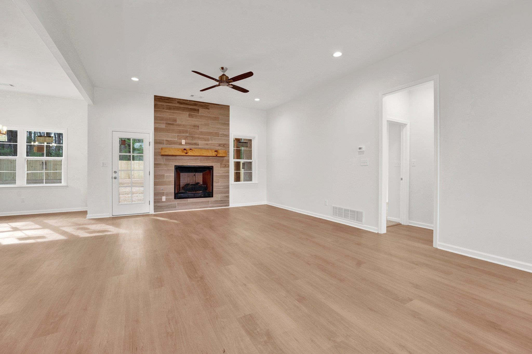 4056 Fonta Road Bartlett, TN 38002 - Photo 8 of 39 Unfurnished living room featuring a ceiling fan, light wood-style flooring, baseboards, visible vents, and recessed lighting