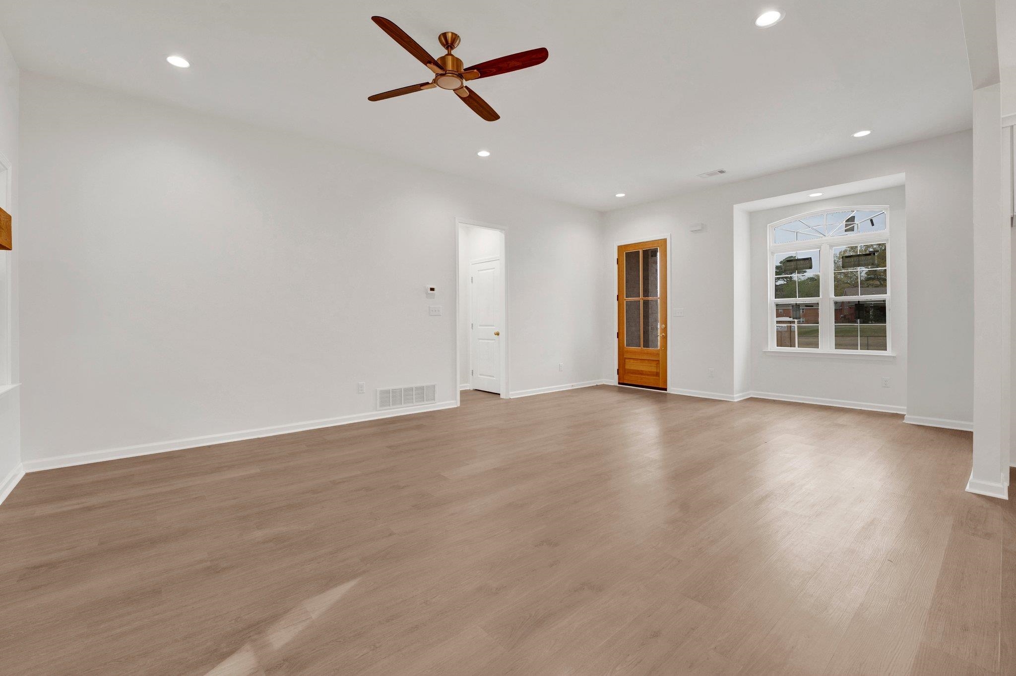 4056 Fonta Road Bartlett, TN 38002 - Photo 9 of 39 Unfurnished living room with baseboards, visible vents, light wood-style floors, ceiling fan, and recessed lighting
