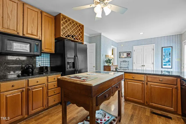 a kitchen with a sink cabinets and window