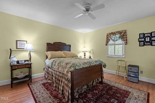 a bedroom with a bed and cabinet