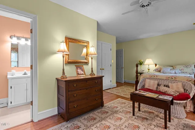 a bathroom with a sink toilet and mirror
