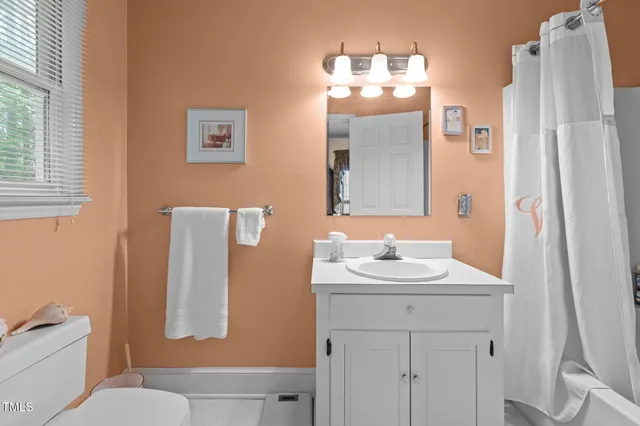 a kitchen with stainless steel appliances granite countertop a stove a sink dishwasher and cabinets with wooden floor