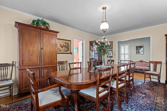 a view of a livingroom with furniture a ceiling fan and window