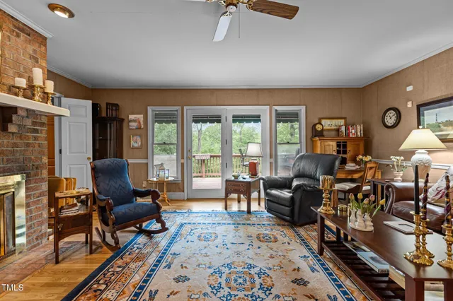 a living room with furniture fireplace and rug