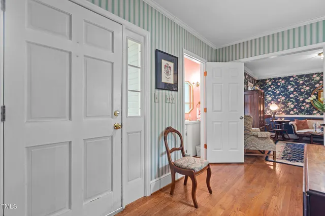 a view of a livingroom with furniture and hardwood floor