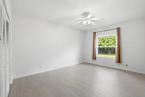 a view of empty room with closet