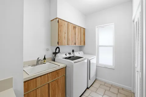 a room with water heater and wooden floor