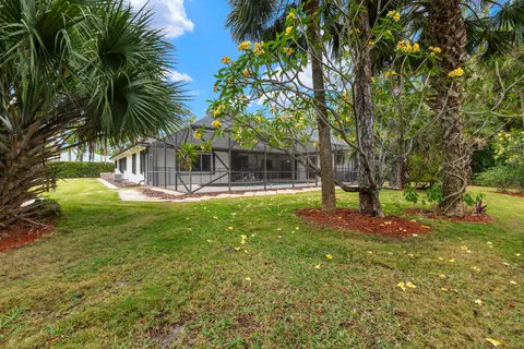 an aerial view of residential houses with outdoor space and seating