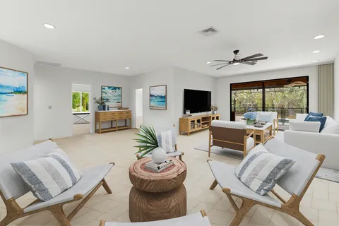 a spacious bedroom with a bed and a large window