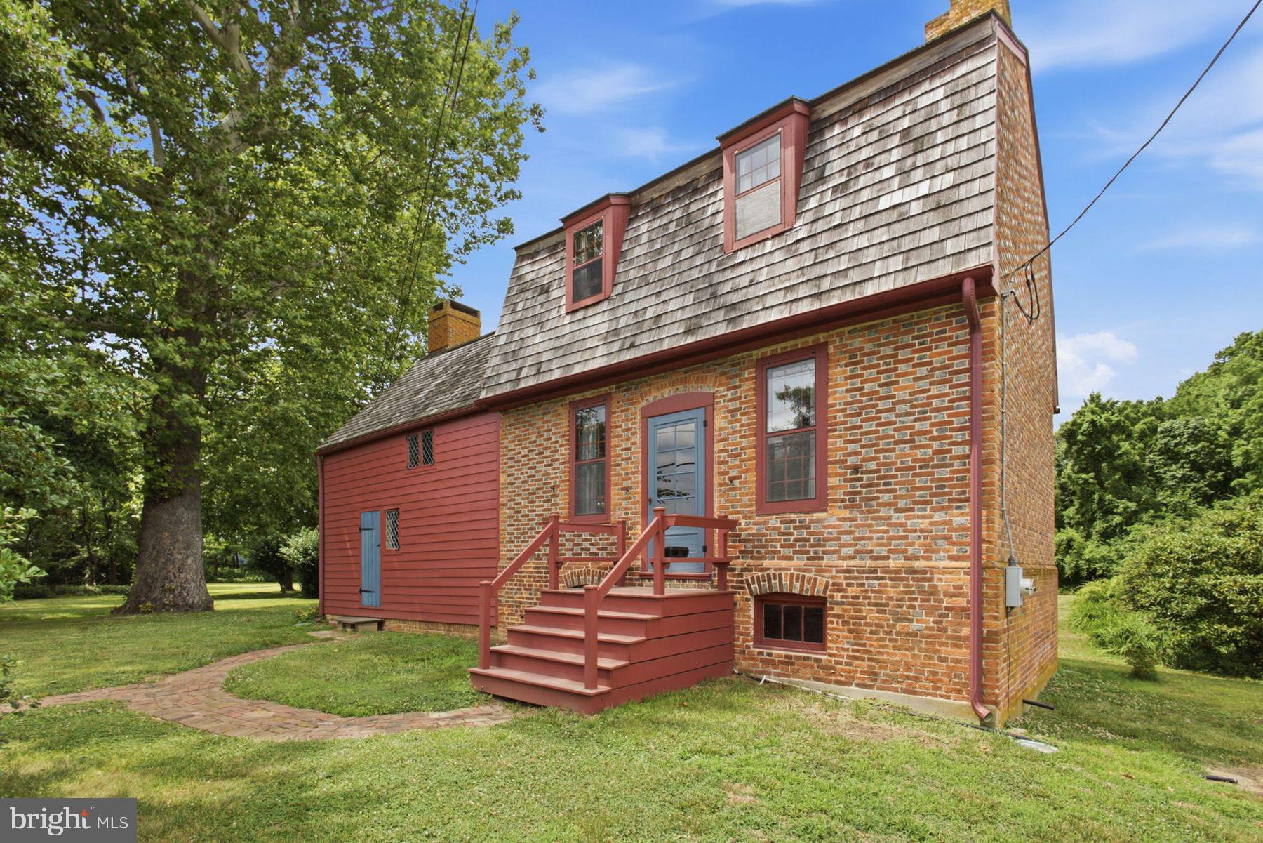 255 Old Mill Road Greenwich, NJ 08323 - Photo 1 of 35 a front view of a house with a garden