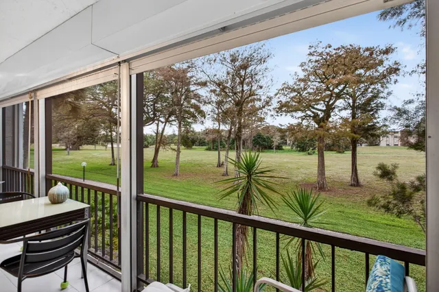 a view of a porch with wooden floor and outdoor space