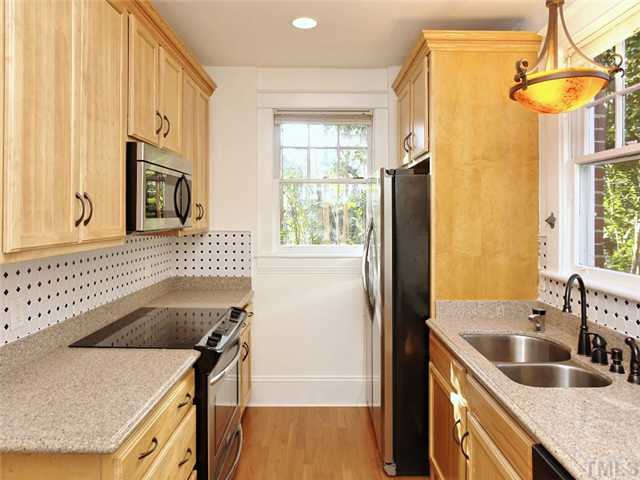 1413 Scales Street Raleigh, NC 27608 - Photo 14 of 24 a kitchen that has a sink a stove and a microwave