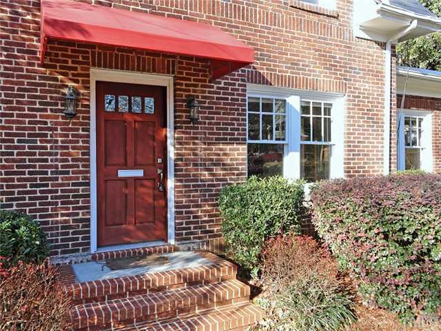 1413 Scales Street Raleigh, NC 27608 - Photo 2 of 24 a front view of a house with a yard