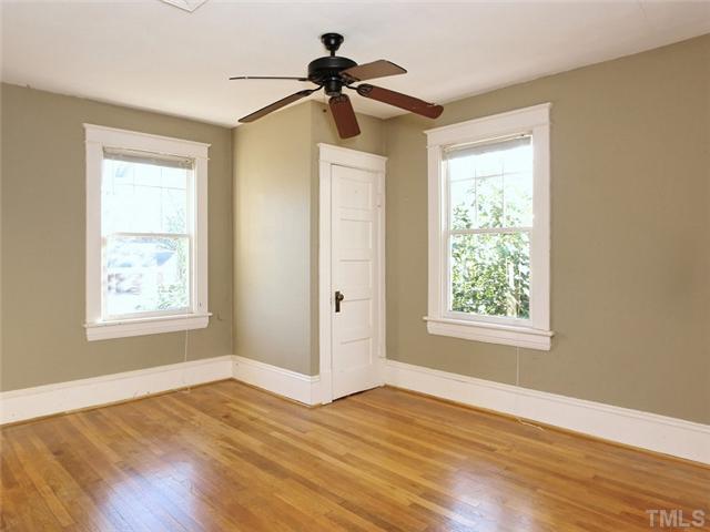 1413 Scales Street Raleigh, NC 27608 - Photo 22 of 24 a view of empty room with wooden floor and fan