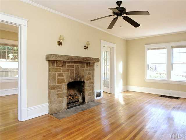 1413 Scales Street Raleigh, NC 27608 - Photo 7 of 24 a view of a livingroom with a fireplace and window