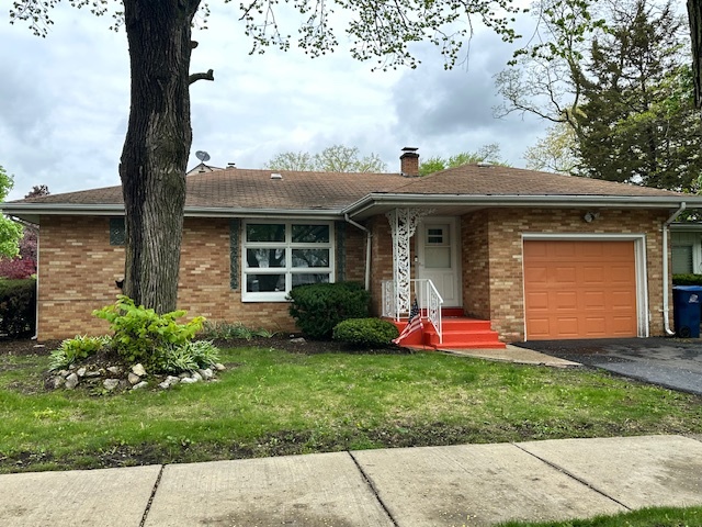2010 West Monroe Street Waukegan, IL 60085 - Photo 1 of 20 a front view of a house with garden