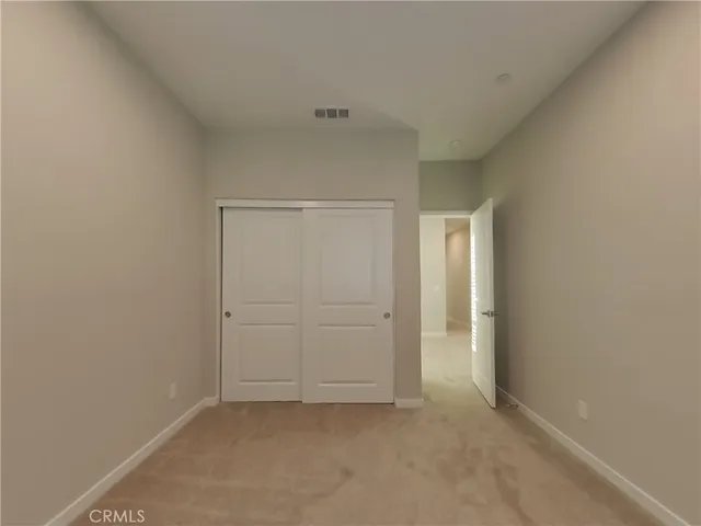 a view of empty room with windows