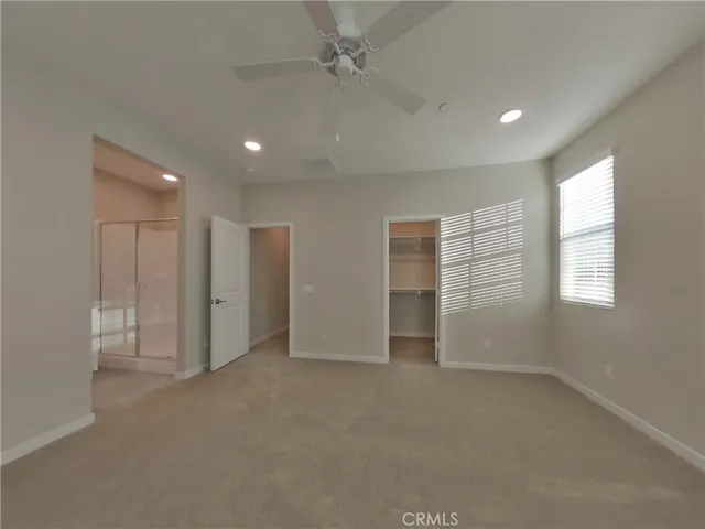 a bathroom with a shower sink vanity and mirror