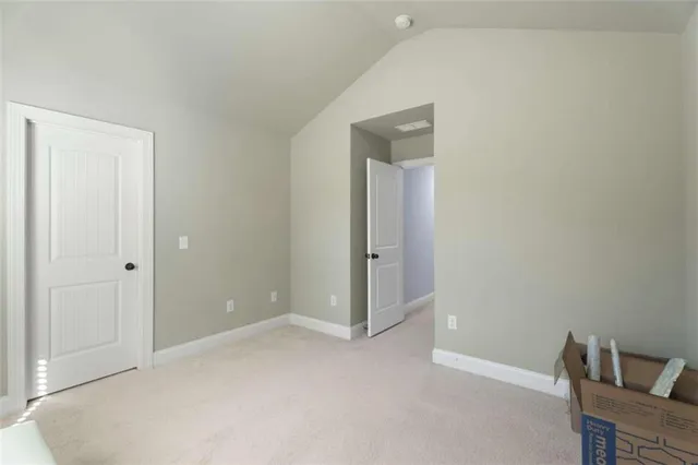 a bedroom with a bed and flat screen tv