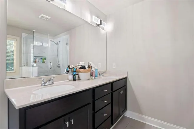 a white toilet sitting next to a white wall