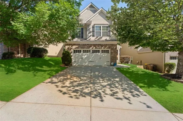 a front view of a house with garden