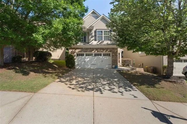a front view of a house with a large window