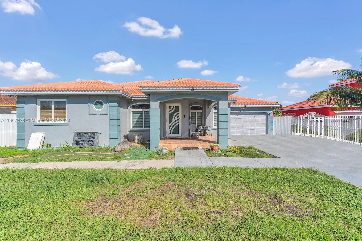 a view of an house with backyard space and balcony