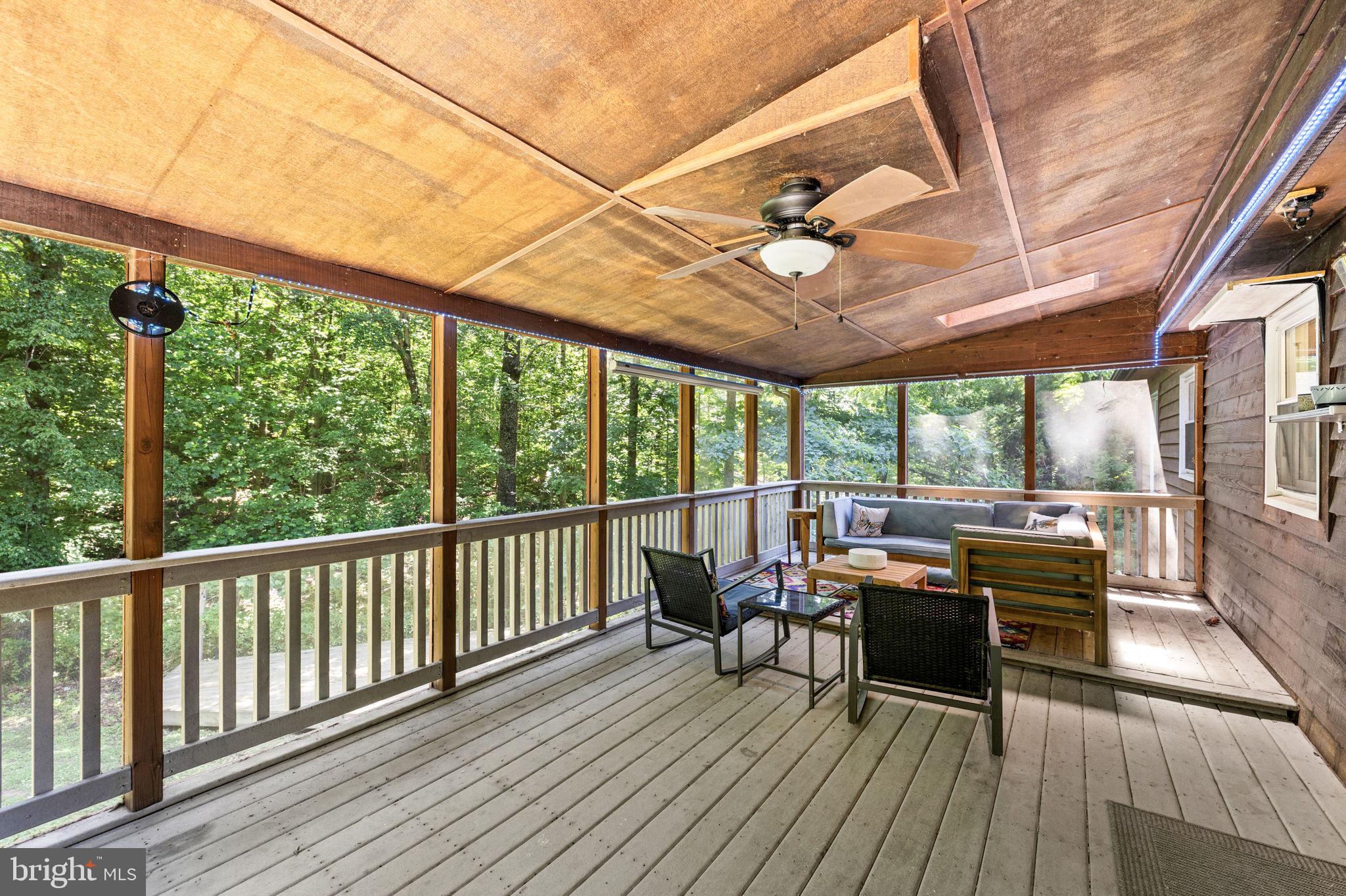 247 Bootons Lane Orange, VA 22960 - Photo 32 of 47 Back deck space with ceiling fan lighting