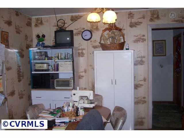 187 Tuggle Road Prospect, VA 23960 - Photo 5 of 5 a living room with furniture and a fireplace