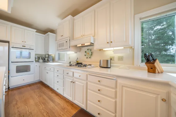 a kitchen with cabinets and appliances