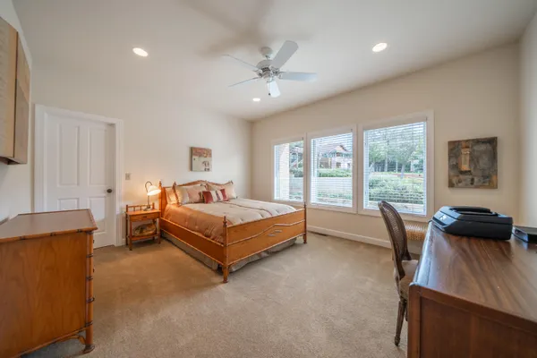 a bedroom with a bed and a couch