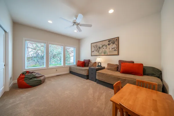 a bed room with furniture and a window