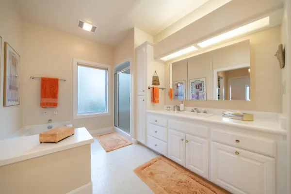 a bathroom with a sink double vanity and mirror