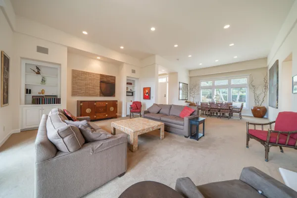 a living room with furniture and flat screen tv