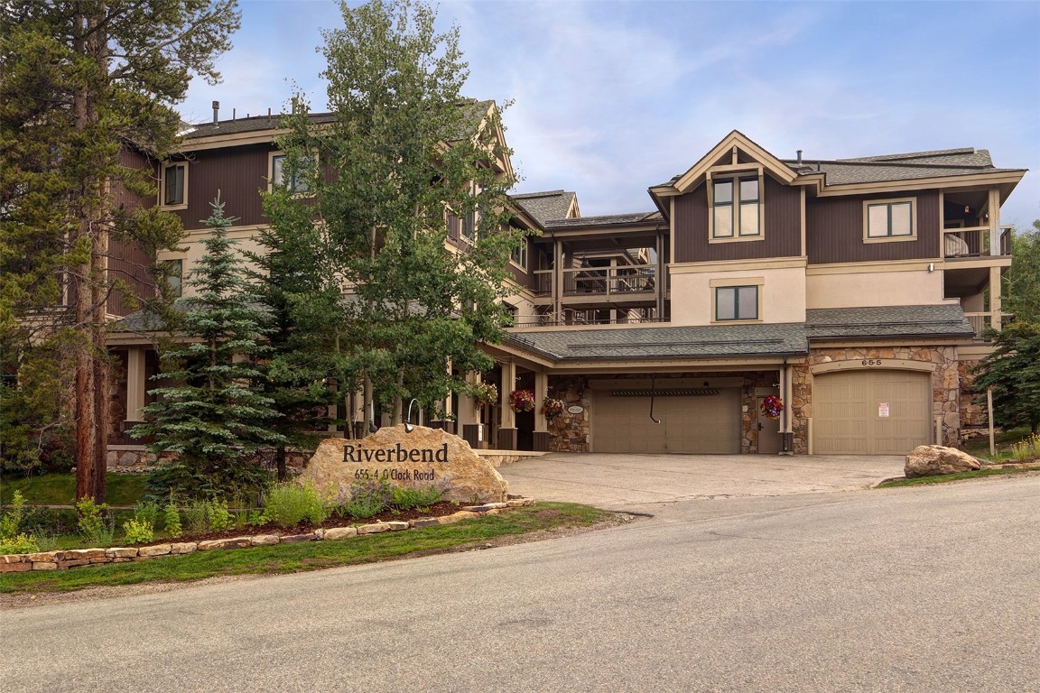 655 4 O Clock Road, Unit 301 Breckenridge, CO 80424 - Photo 17 of 23 a front view of a house with a yard
