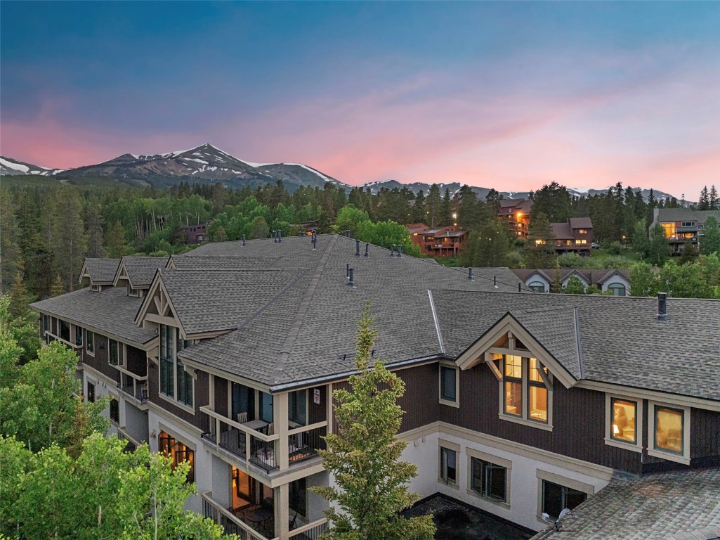 655 4 O Clock Road, Unit 301 Breckenridge, CO 80424 - Photo 21 of 23 a aerial view of a house with a swimming pool and a yard