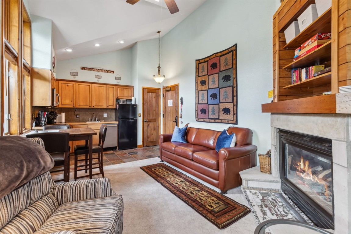 655 4 O Clock Road, Unit 301 Breckenridge, CO 80424 - Photo 8 of 23 a living room with furniture and a fireplace