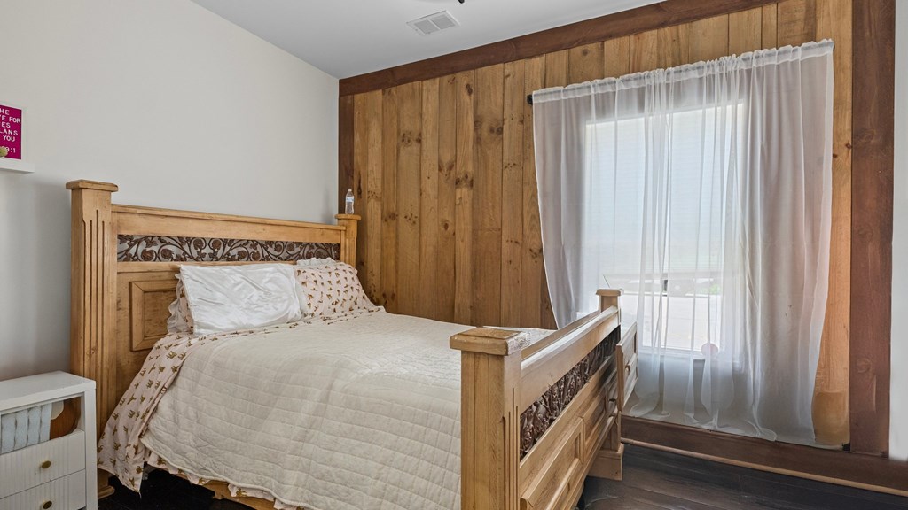 610 Madola Road Epworth, GA 30541 - Photo 9 of 16 a bedroom with a bed and a window