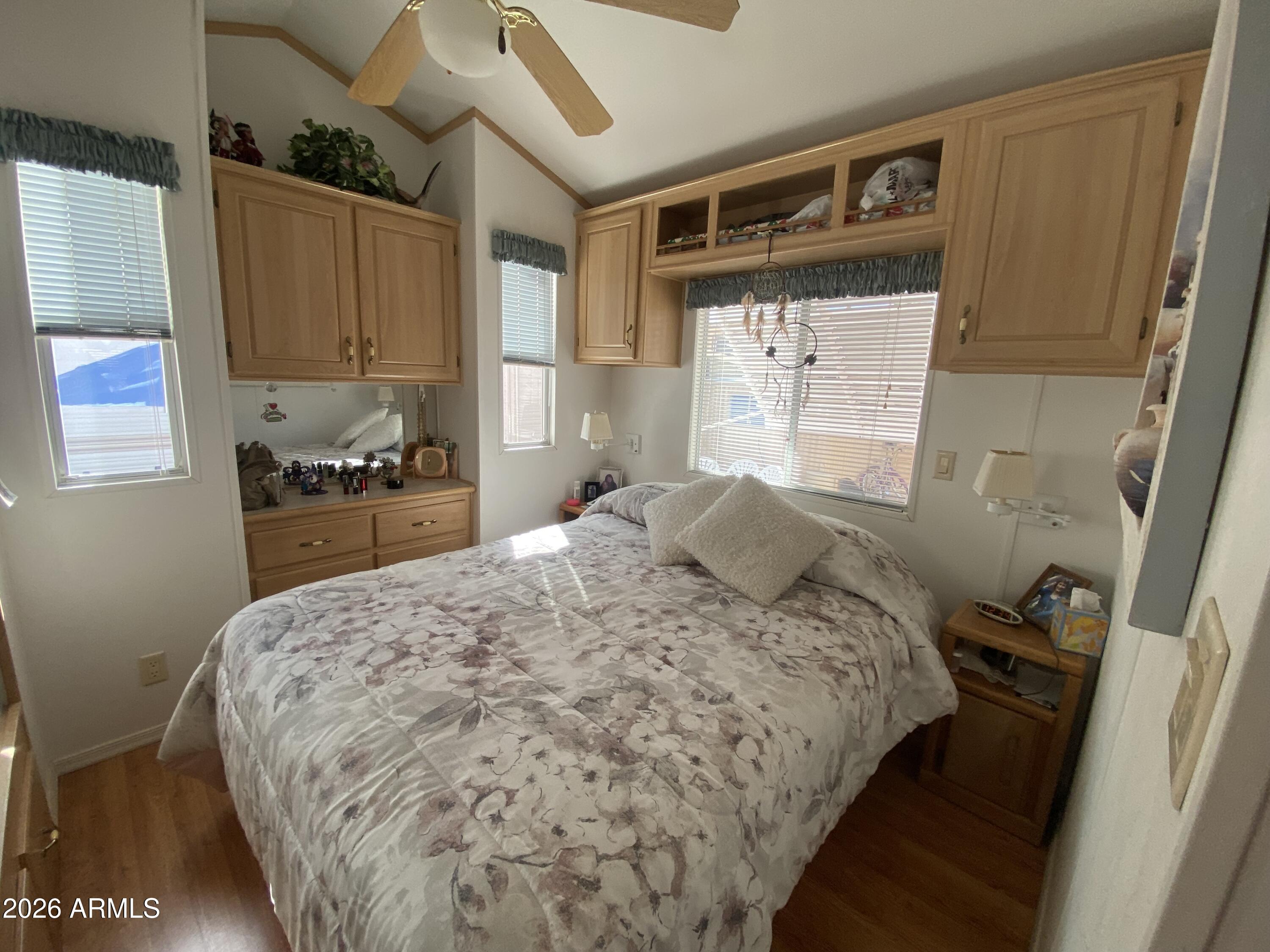 1336 West Inuit Avenue, Unit 336 Apache Junction, AZ 85119 - Photo 23 of 35 a bedroom with a bed and a window